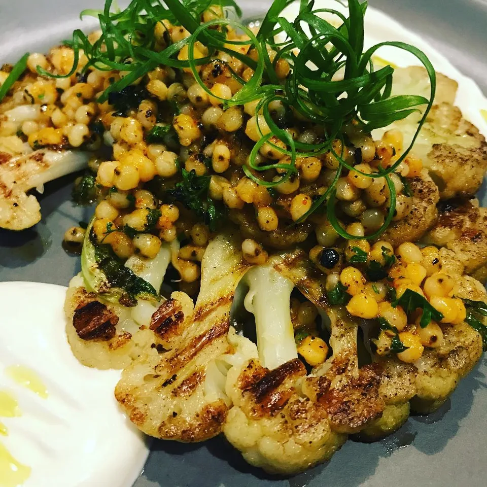 Local infused... #charredcauliflower topped with #jowar and flavor!…, 1 of 1