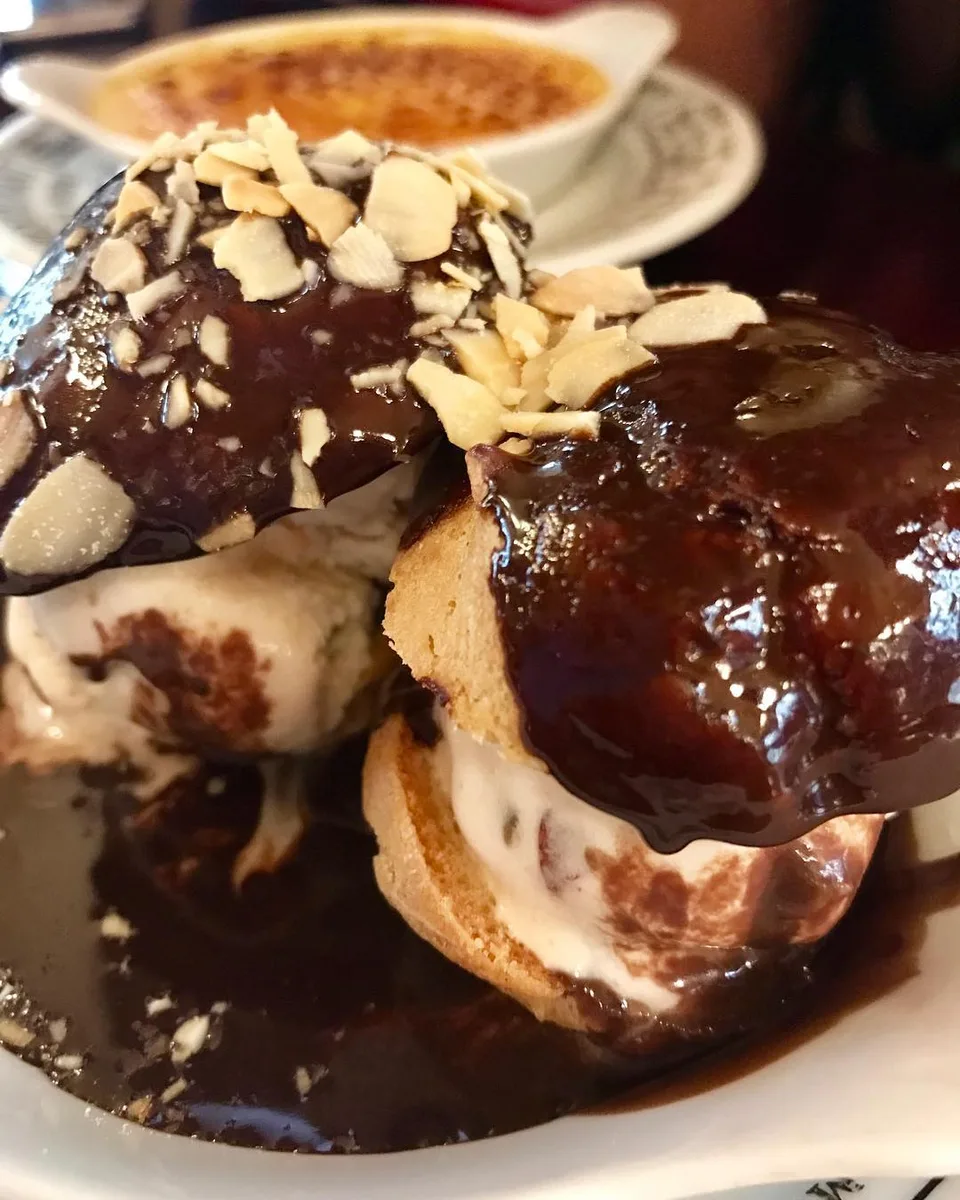Indulgence #foodsofeurope #profiterole #cremebrulee #desserts #artofcooking…, 1 of 1